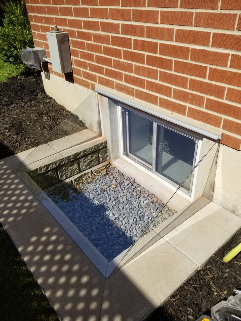 Custom clear sloped basement window well cover